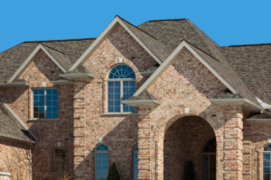 Shingle roof brick mansion