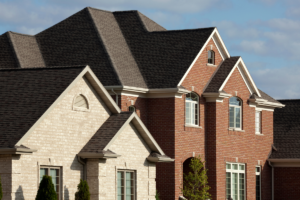 Two houses with asphalt shingle roof.