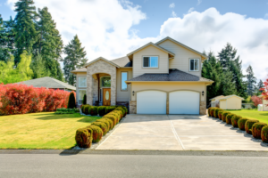 Exterior view of a well-maintained two-story suburban home with a clean roof and manicured front lawn.